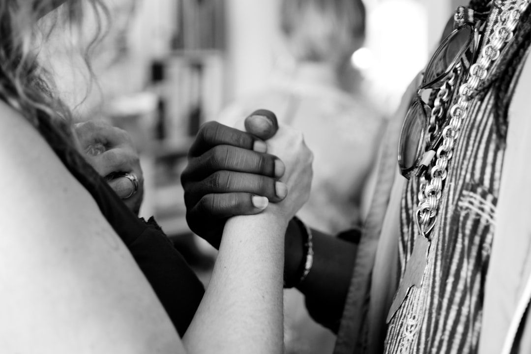 Close-up of two partners clasping hands during a swing dance