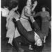 Black-and-white photo of energetic couples dancing on a social floor